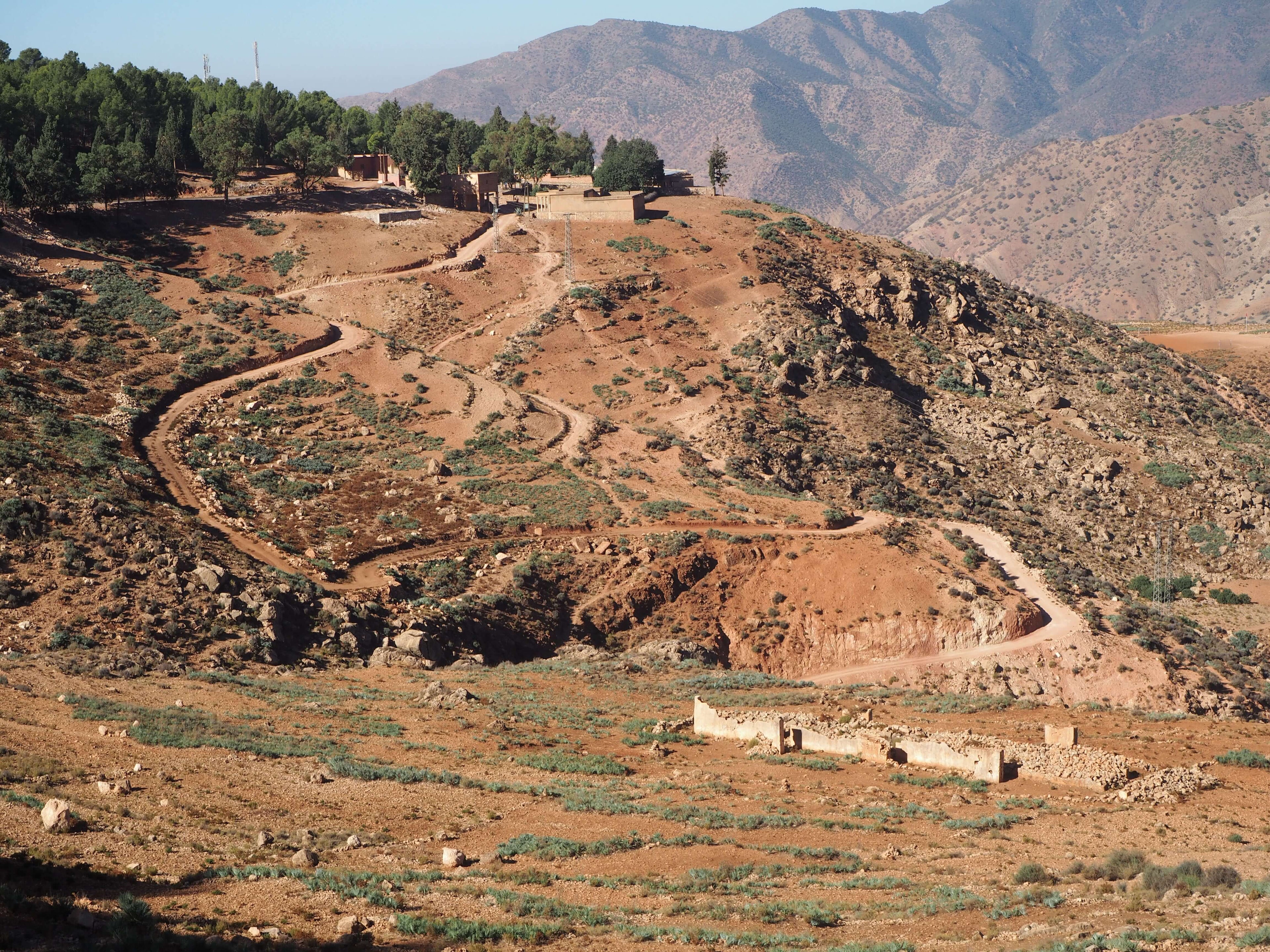 Fantastic motocycle ride through a winding, dirt, mountain road in Morrocco