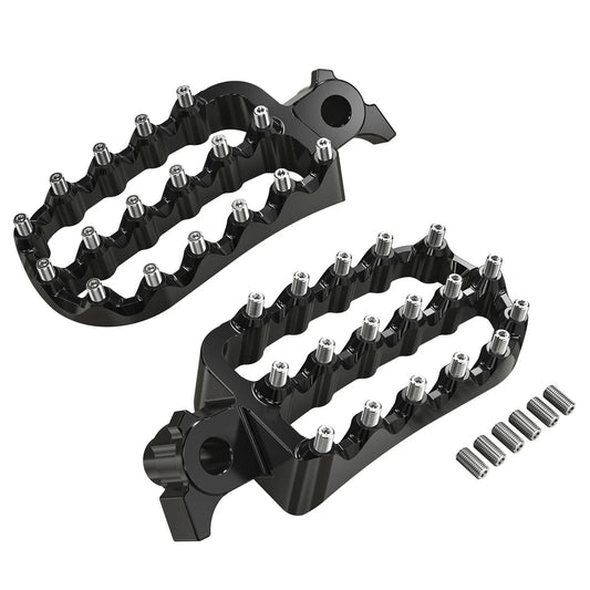 Black metal foot pegs with studs on a white background