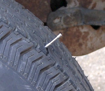 tyre with air stopper tool inserted